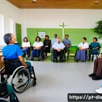 장애인재활상담사 직업 만족 사례 - A warm and compassionate scene in a modern rehabilitation center in Brazil, showing a diverse group ...